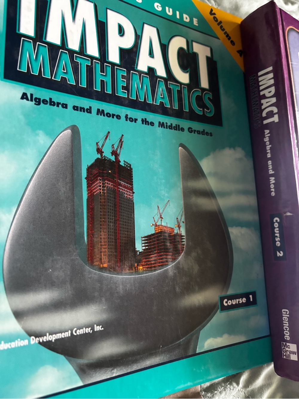 2 textbooks textbook IMPACT Mathematics, Course 2, Student Edition